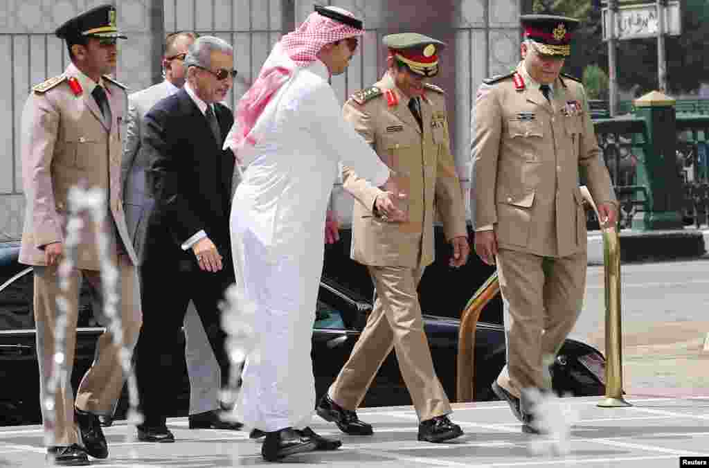 Abdulrahman Al-Banyan (2nd right), Saudi Arabia's Chief of Staff, arrives at the Arab League headquarters to attend the Arab defense ministers meeting in Cairo, April 22, 2015.