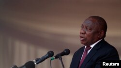 President of South Africa Cyril Ramaphosa speaks during a state funeral of Zimbabwe's longtime ruler Robert Mugabe, at the national sports stadium in Harare, Zimbabwe, Sept. 14, 2019.
