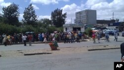 Addis Ababa residents standing in long lines to buy sugar and edible oil