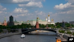 A view of the Big Kremlin Palace and Churches with the Moskva River in Moscow, Russia, June 2, 2022. Just before the 1917 revolution, Russia was the world's largest net international debtor. More than a century later, Russia stands on the brink of default.