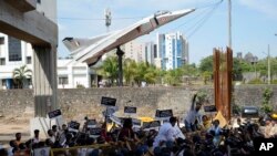 FILE - Congress party workers protest against against a new short-term government recruitment scheme for the military, in Mumbai, India, June 18, 2022. 