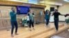 Members of the Lighthouse Christian Fellowship Church congregation perform during Sunday service on June 26, 2022. Trinity Wicker is in the back row on the right.