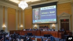 An image of former President Donald Trump phoning into a Fox News interview is shown on a screen, as the House select committee investigating the Jan. 6 attack on the U.S. Capitol continues to reveal its findings of a yearlong investigation, June 23, 2022