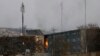 Flames rise from a government building after an explosion and attack by gunmen, in Kabul, Afghanistan, Monday, Dec. 24, 2018. 