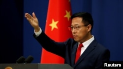 FILE - Chinese Foreign Ministry spokesman Zhao Lijian attends a news conference in Beijing, China Sept. 10, 2020.
