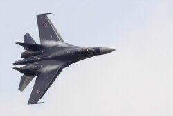 FILE - A Sukhoi Su-35 fighter with special vectored thrust jet engines takes part in a flying display at the Le Bourget airport near Paris.