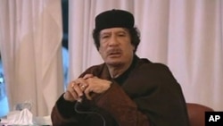 This image taken from Libya State TV shows Libyan leader Moammar Gadhafi, March 15, 2011