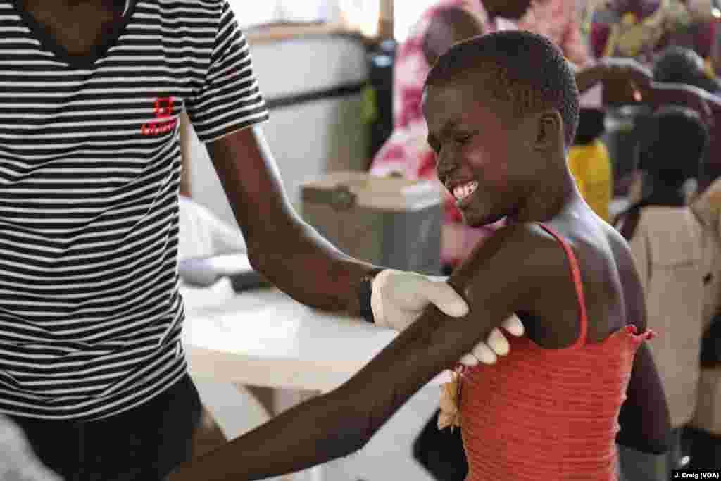 South Sudanese girl cries after receiving vaccination in the Imvepi refugee settlement’s processing center. Photo taken March 31 in Arua, Uganda. 