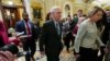 Senate Minority Leader Mitch McConnell walks past members of the media after delivering remarks on the Senate floor on Feb. 28, 2024, on Capitol Hill in Washington. McConnell says he'll step down as Senate Republican leader in November.