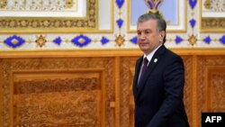 Uzbek President Shavkat Mirziyoyev walks to attend the Conference on Interaction and Confidence-Building Measures in Asia in Dushanbe on June 15, 2019.