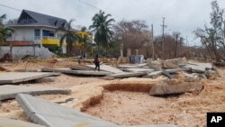 A road that runs along the shore lays in pieces after the passing of Hurricane Iota on San Andres Island, Colombia, Nov. 17, 2020. 