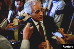 FILE - Senator Bob Corker speaks to reports at the US Capitol in Washington, April 21, 2015.