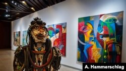 A sculpture by Cameroonian artist Joseph-Francis Sumégné titled “Mon portrait sur ton visage” is displayed at Dakar's Museum of Black Civilizations. (Photo: A. Hammerschlag/VOA)