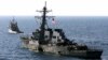 FILE - The U.S. Navy destroyer USS Cole is towed away from the port city of Aden, Yemen, into open sea, Oct. 29, 2000. 