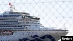 Le navire de croisière Diamond Princess, où des dizaines de passagers ont été testés positifs au coronavirus, au terminal de croisière de Daikoku Pier à Yokohama, au sud de Tokyo, au Japon, le 11 février 2020. REUTERS / Issei Kato - RC28YE9QKDKY
