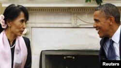 U.S. President Barack Obama meets with Aung San Suu Kyi at the White House in Washington, September 19, 2012.