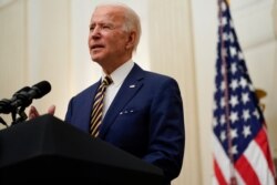 President Joe Biden delivers remarks on the economy in the State Dining Room of the White House, Jan. 22, 2021, in Washington.