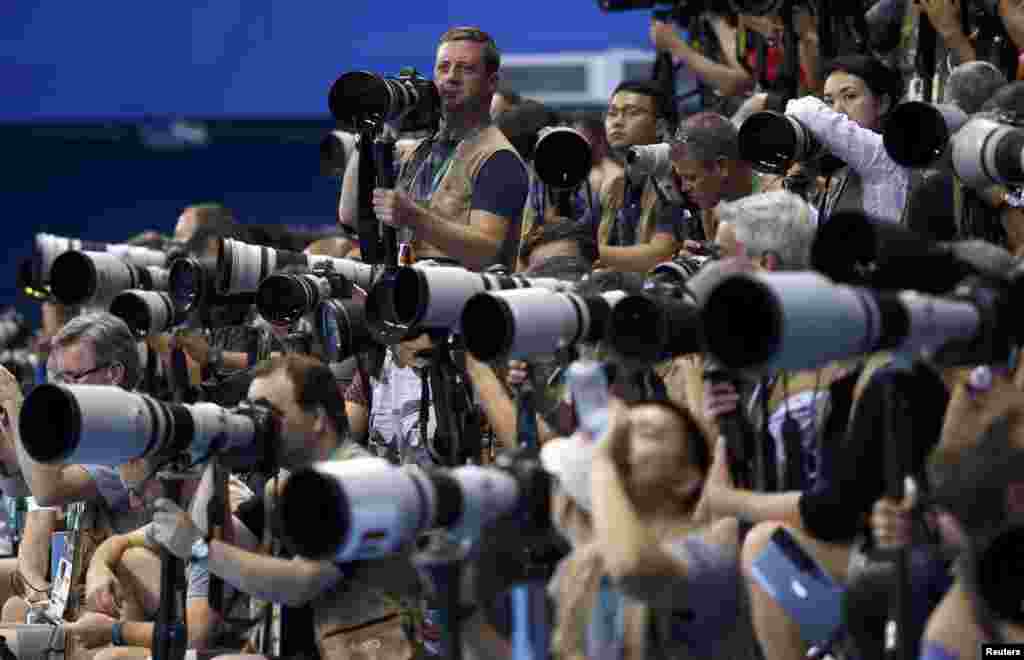 Photographers take photos of men&#39;s 100m freestyle semi-finals at Olympic Aquatics Stadium during the Rio Olympics in Rio de Janeiro, Brazil.