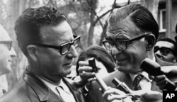 FILE - Salvador Allende (L) of the Marxist left-wing coalition is congratulated on his victory in the Chilean presidential election by Christian Democrat candidate Radomiro Tomic at Allende's home, Sept. 5, 1970 in Santiago, Chile.
