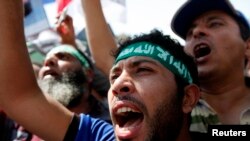 Supporters of Morsi rally in the suburb of Nasr City, Cairo, June 28, 2013.