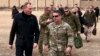Acting Defense Secretary Pat Shanahan, left, arrives in Kabul, Afghanistan, Feb. 11, 2019, to consult with Army Gen. Scott Miller, right, commander of U.S. and coalition forces, and senior Afghan government leaders.