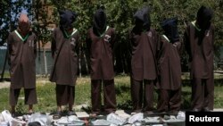 FILE - Insurgents suspected of being from the Haqqani network are presented to the media at the National Directorate of Security (NDS) headquarters in Kabul, Afghanistan, May 30, 2013. Afghan President Ashraf Ghani and U.S. officials allege Haqqanis operate out of sanctuaries in Pakistan, a charge Islamabad rejects.