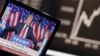 FILE - US President-elected Donald Trump is displayed on a television screen with the curve of the German stock index DAX in background at the stock market in Frankfurt, Germany, Nov. 9, 2016.