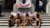 Members of the Khoi, an indigenous group, picket outside the high court during a hearing, as they oppose development of the new Africa headquarters and residential buildings of U.S. retail giant Amazon, in Cape Town, South Africa, Jan. 21, 2022.
