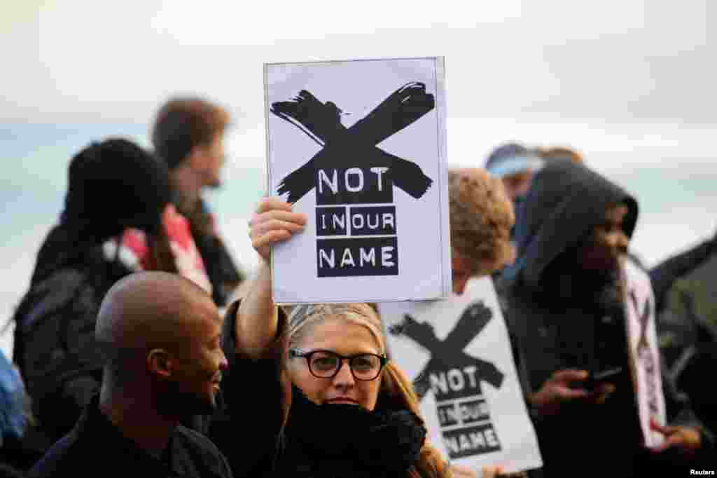 Demonstrators protest against the decision by public broadcaster the South African Broadcasting Corporation (SABC) that it would not broadcast scenes of violent protest, in Cape Town, South Africa.