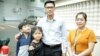 FILE - Former Radio Free Asia reporters Yeang Sothearin and his family pose for picture outside Phnom Penh Municipal Court Friday, August 30, 2019. (Tum Malis/VOA Khmer)