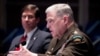 Defense Secretary Mark Esper, left, listens as Chairman of the Joint Chiefs of Staff Gen. Mark Milley testifies during a House Armed Services Committee hearing on Thursday, July 9, 2020, on Capitol Hill in Washington. (Michael Reynolds/Pool via AP)