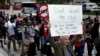 FILE - Demonstrators march in support of Deferred Action for Childhood Arrivals (DACA) and Temporary Protected Status (TPS) programs in Miami, Jan. 17, 2018. 