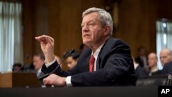 Retiring Montana Sen. Max Baucus testifies on Capitol Hill in Washington, Jan. 28, 2014, before the Senate Foreign Relations Committee hearing on his nomination to become U.S. ambassador to China.