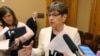 FILE - Kansas Gov. Laura Kelly speaks with reporters at the Statehouse in Topeka, Kansas, June 5, 2019.