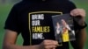 FILE - Harrison Li holds a photo of his father, Kai Li, in Palo Alto, California, Jan. 23, 2024. The White House announced Nov. 27, 2024, the release of three Americans it said had been wrongfully detained in China for many years: Mark Swidan, Kai Li and John Leung.