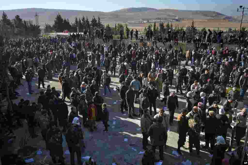 People stand outside the infamous Saydnaya military prison, just north of Damascus, Syria, Dec. 9, 2024. 