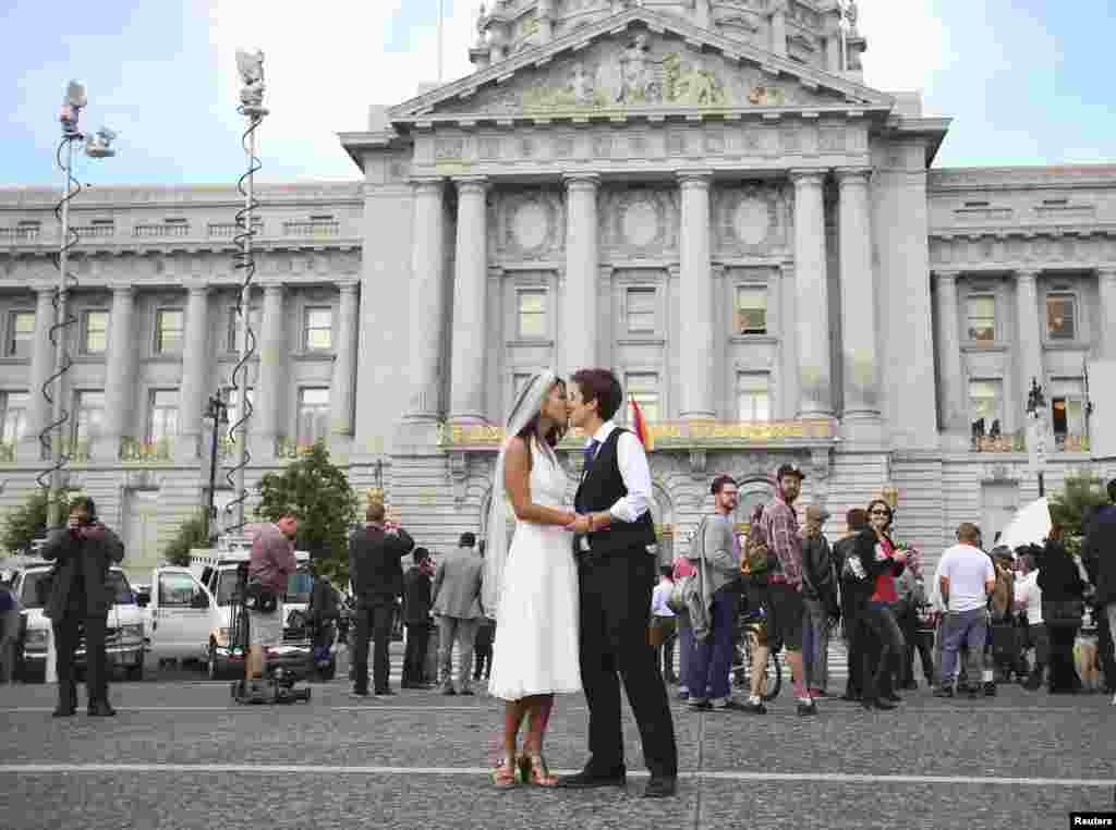Lisa Dazols (R) and Jenny Chang celebrate after the U.S. Supreme Court ruled on California's Proposition 8 and the federal Defense of Marriage Act, outside the city hall in San Francisco, California. The U.S. Supreme Court handed a significant victory to gay rights advocates by recognizing that married gay men and women are eligible for federal benefits and paving the way for same-sex marriage in California.