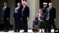 (L-R) President Barack Obama, former presidents George W. Bush, Bill Clinton, George H.W. Bush, and Jimmy Carter (R) at the dedication of the George W. Bush presidential library on the campus of Southern Methodist University in Dallas, April 25, 2013. 