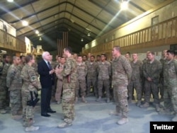 Sen. John McCain visits with members of the 41st Expeditionary Electronic Combat Squadron deployed from Davis-Monthan Air Force Base in Tucson, Arizona.