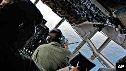 Brazilian Air Force officers look for signs of Air France flight 447 as they patrol the crash area in the open Atlantic Ocean some 745 miles (1,200 km) northeast of Recife (file photo)