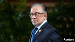 FILE - Malaysian Prime Minister Anwar Ibrahim is shown in Tokyo, Japan, May 23, 2024. Anwar said on Thursday Malaysia will not stop its oil and gas exploration in the South China Sea.