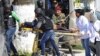 A victim is being evacuated by rescue workers outside the Bardo museum in Tunis, March 18, 2015 in Tunis, Tunisia.