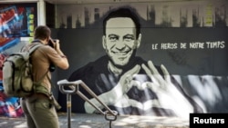 FILE - Graffiti of Alexey Navalny by Swiss artists Julien Baro & Lud is pictured ahead of the June 16 summit between U.S. President Joe Biden and Russian President Vladimir Putin in Geneva, Switzerland, June 14, 2021. The text reads: Hero of our Time.