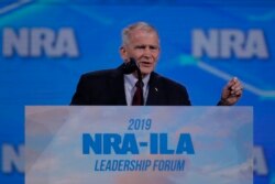 FILE - Nation Rifle Association President Lt. Col. Oliver North (Ret.) speaks at the National Rifle Association Institute for Legislative Action Leadership Forum in Indianapolis, Indiana, April 26, 2019.