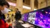 FILE - A staff member monitors thermal scanners that detect temperatures of passengers at the Hankou Railway Station in Wuhan, China, Jan. 21, 2020. To help guard against coronavirus, Senegal installed thermal cameras at the shipping port and airport.