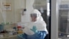 A laboratory specialist examines specimens of the Ebola virus at the Uganda virus research centre in Entebbe, 40km (25 miles) south from capital Kampala, May 17, 2011. 