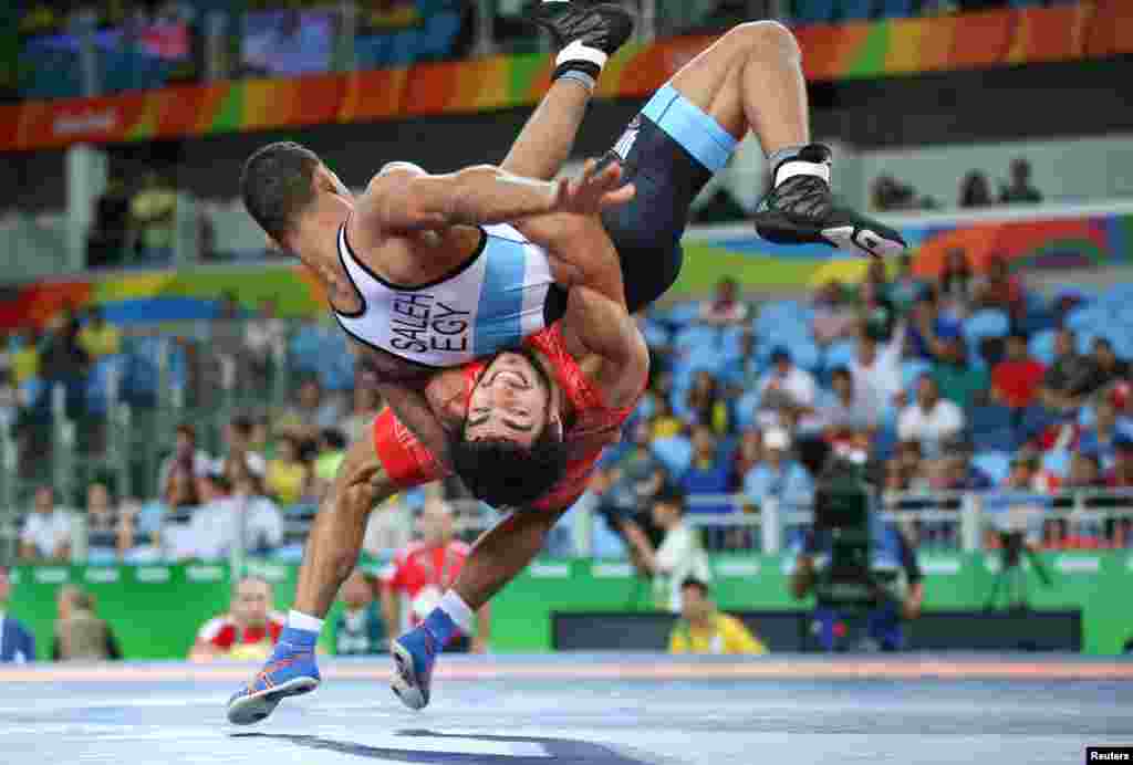 Migran Arutyunyan of Armenia and Adham Ahmed Saleh Ibrahim Kahk of Egypt compete in Greco-Roman wrestling.