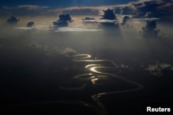 FILE - Aerial view of a river in Peru's Amazon region of Loreto, Sept. 29, 2014.