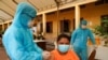 FILE PHOTO: Cambodian army members vaccinate people in Phnom Penh