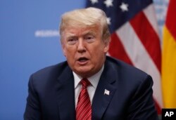 FILE - President Donald Trump speaks to media at the G-20 summit, in Buenos Aires, Argentina, Dec. 1, 2018.